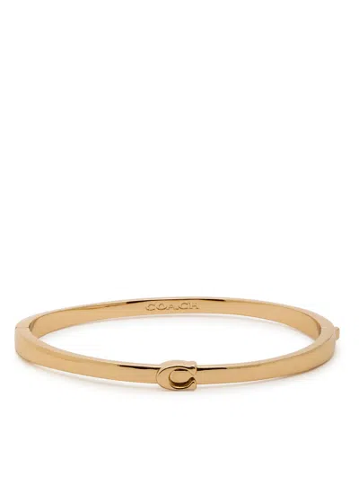 Coach Logo Bangle In Gold