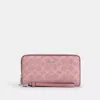 Coach Long Zip Around Wallet In Signature Canvas In Pink