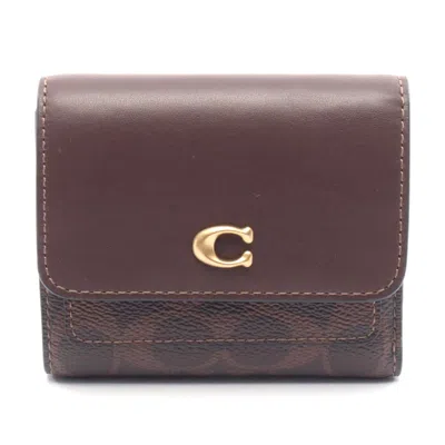 Coach Mila Leather Pvc Trifold Wallet In Brown