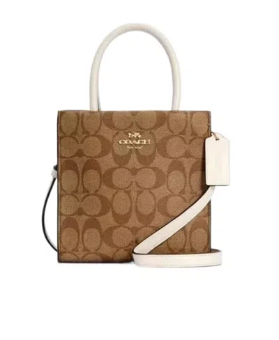 Coach Mini Cally Skew Cross Package In Brown
