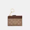 Coach Mini Skinny Id Case In Signature Canvas In Brown
