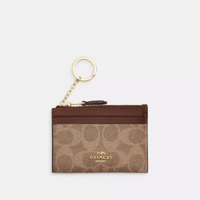 Coach Mini Skinny Id Case In Signature Canvas In Brown