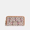 Coach Outlet Accordion Zip Wallet In Signature Textile Jacquard With Penguin Motif In Brown