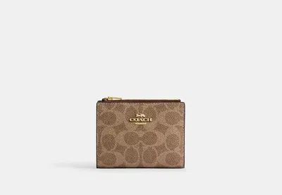 Coach Outlet Bifold Wallet In Signature Canvas In Brown