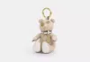 Shop Coach Outlet Collectible Bear Bag Charm In Signature Canvas In Beige
