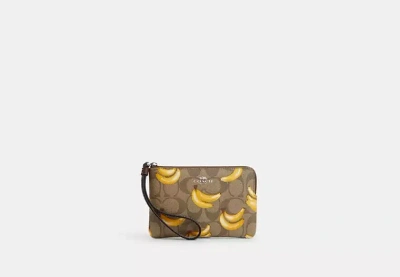 Coach Outlet Corner Zip Wristlet In Signature Canvas With Banana Print In Brown