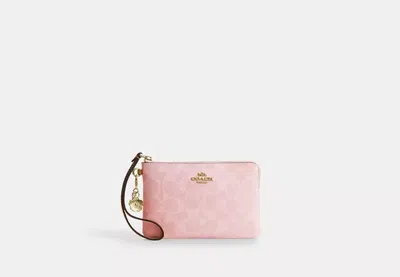 Coach Outlet Corner Zip Wristlet In Signature Canvas With Charms In Pink