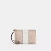 COACH OUTLET CORNER ZIP WRISTLET IN SIGNATURE CANVAS WITH STRIPE