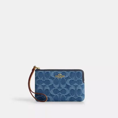 Coach Outlet Corner Zip Wristlet In Signature Denim In Blue