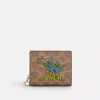 Coach Outlet Cosmic Coach Snap Wallet In Signature Canvas With Rexy Print In Multi