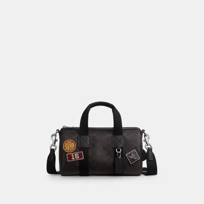 Coach Outlet Explorer Duffle Bag 28 In Signature Canvas With Patches In Pink