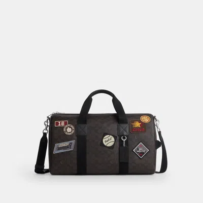 Coach Outlet Explorer Duffle Bag 45 In Signature Canvas With Patches In Brown