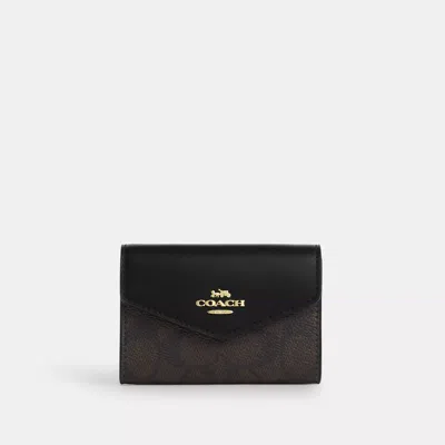 Coach Outlet Flap Card Case In Signature Canvas In Brown