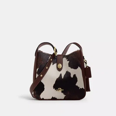 Coach Outlet Hadley Convertible Crossbody Bag With Cow Print And Tassel In Gold