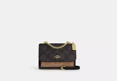 Coach Outlet Klare Crossbody Bag In Blocked Signature Canvas In Brown