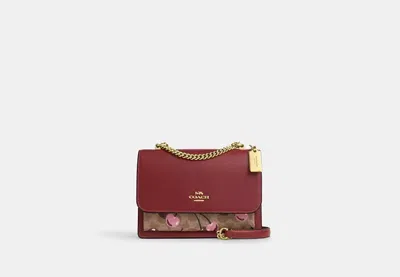 Coach Outlet Klare Crossbody Bag In Signature Canvas With Cherry Print In Red