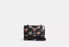 Coach Outlet Klare Crossbody Bag With Heart Bolt Print In Black