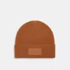 Coach Outlet Knit Beanie With Rubber Patch In Brown