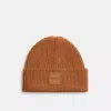 Coach Outlet Knit Beanie With Rubber Patch In Brown