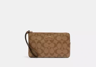 Coach Outlet Large Corner Zip Wristlet In Signature Canvas In Beige