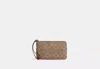 Coach Outlet Large Corner Zip Wristlet In Signature Canvas In Brown