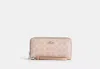 Coach Outlet Long Zip Around Wallet In Signature Canvas In Beige