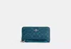 Coach Outlet Long Zip Around Wallet In Signature Canvas In Blue