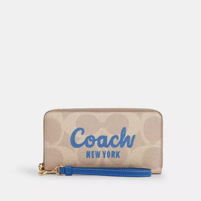 Coach Outlet Long Zip Around Wallet In Signature Canvas With Coach Graphic In Beige