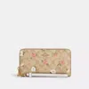 COACH OUTLET LONG ZIP AROUND WALLET IN SIGNATURE CANVAS WITH FLORAL PRINT