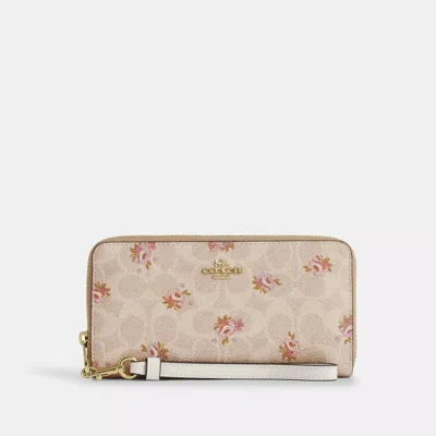 COACH OUTLET LONG ZIP AROUND WALLET IN SIGNATURE CANVAS WITH FLORAL PRINT
