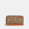Coach Outlet Long Zip Around Wallet In Signature Canvas With Orange Print
