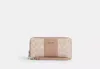 Coach Outlet Long Zip Around Wallet In Signature Canvas With Stripe In Beige