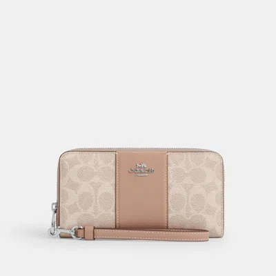 Coach Outlet Long Zip Around Wallet In Signature Canvas With Stripe In Sand