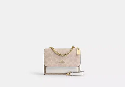 Coach Outlet Mini Klare Crossbody Bag In Signature Canvas In Beige
