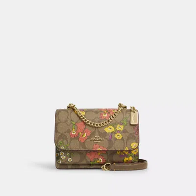 Coach Outlet Mini Klare Crossbody In Signature Canvas With Floral Print In Beige