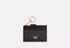 Shop Coach Outlet Mini Skinny Id Case In Signature Canvas In Beige