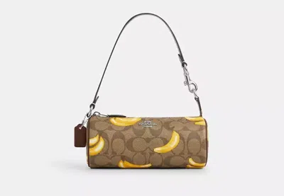 Coach Outlet Nolita Barrel Bag In Signature Canvas With Banana Print In Beige