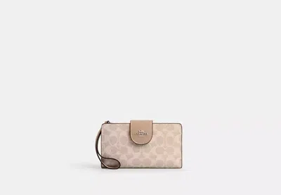 Coach Outlet Phone Wallet In Signature Canvas In Beige
