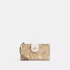 COACH OUTLET PHONE WALLET IN SIGNATURE CANVAS WITH FLORAL PRINT