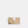 Coach Outlet Phone Wallet In Signature Canvas With Floral Print In Beige