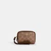 Coach Outlet Pouch Wristlet In Signature Canvas In Beige