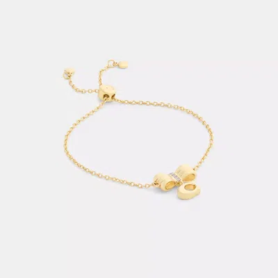 Coach Outlet Signature Bow Slider Bracelet In Gold