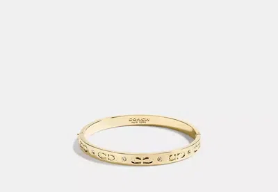 Coach Outlet Signature Hinged Bangle In Gold