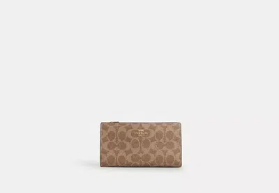 Coach Outlet Slim Zip Wallet In Signature Canvas In Brown