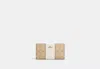 Coach Outlet Slim Zip Wallet In Signature Canvas With Stripe In Brown