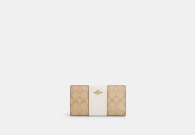 Coach Outlet Slim Zip Wallet In Signature Canvas With Stripe In Brown