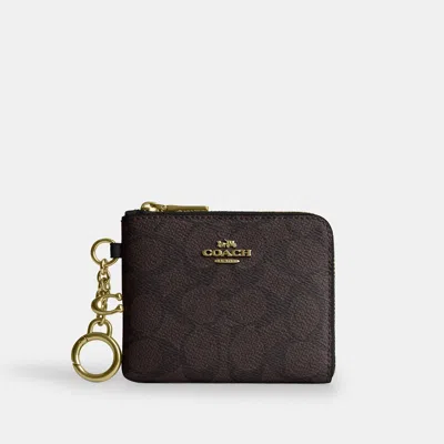 Coach Outlet Small Corner Zip Wallet In Signature Canvas In Brown