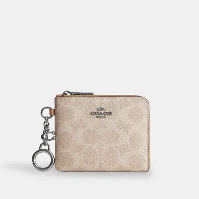 Coach Outlet Small Corner Zip Wallet In Signature Canvas In Brown