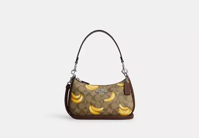 Coach Outlet Teri Shoulder Bag In Signature Canvas With Banana Print In Brown