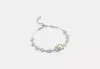 Coach Outlet Wildflower Chain Signature Linear Bracelet In Metallic
